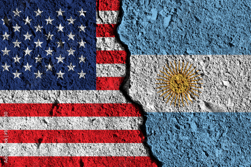 Crack between America and Argentina flags. political relationship concept