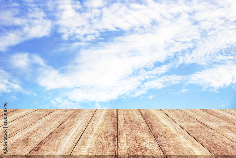 Wooden table and blue sky background