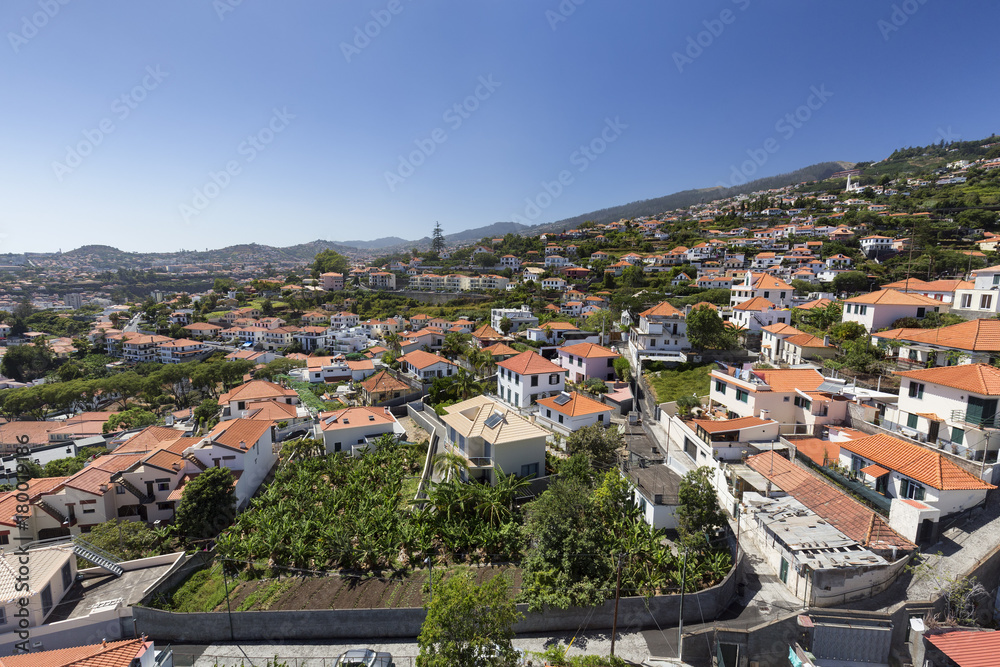 Aerial view of the city of Funchal as it rises into the mountains in Madeira.