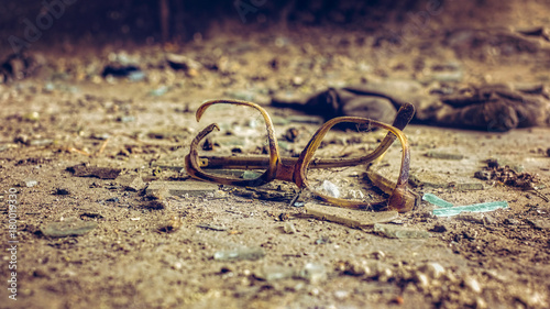 Frame of glasses forgotten in time in the hall of an abandoned factory