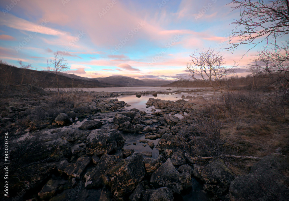 Pink clouds over the river, Finland, Natural Park Kilpisjarvi Pink clouds over the river, Finland, Natural Park Kilpisjarvi