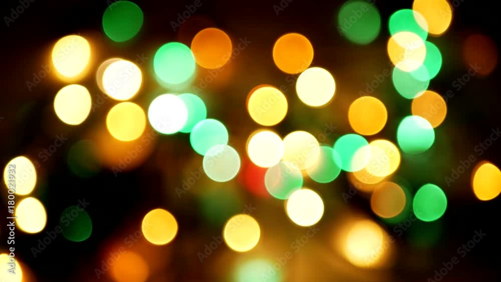 Multicolored blurred lights background. Moving bokeh circles Multicolored blurred lights background. Moving bokeh circles