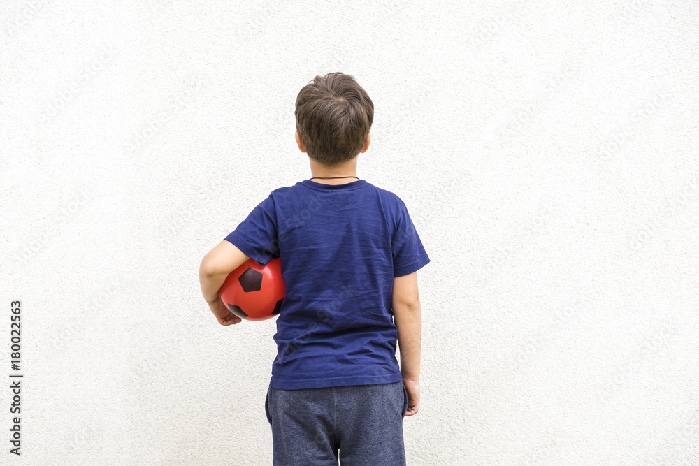 Little Boy In Blue Shirt Holding Red Ball Back View Copyspace For Text Stock Photo Adobe Stock