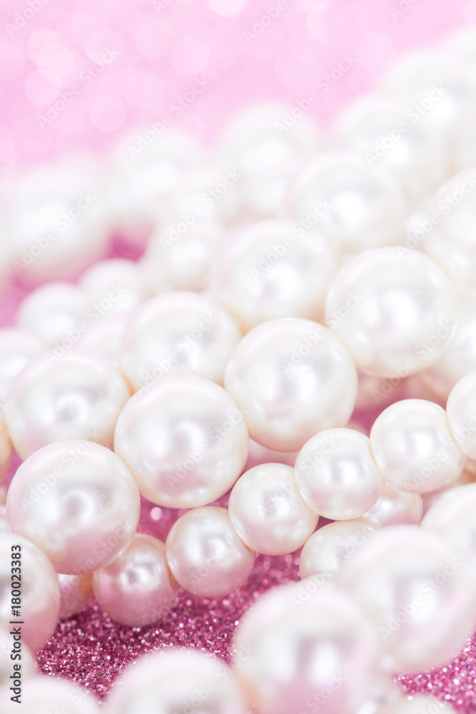 Pile of pearls on pink festive background
Pile of pearls on pink festive background