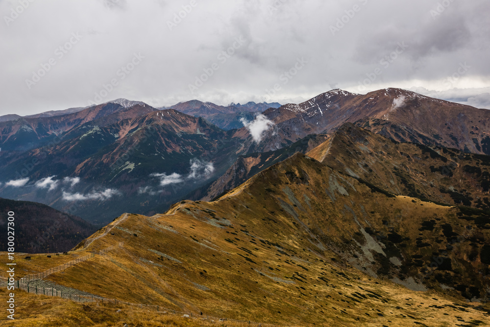 View from the peak of Kasprowy Wierch on the mountain massif Czerwone Wierchy in Tatra mountains, Poland View from the peak of Kasprowy Wierch on the mountain massif Czerwone Wierchy in Tatra mountains, Poland