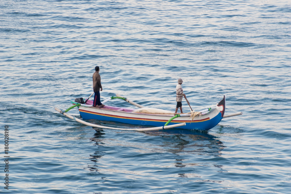 Fototapeta premium traditional boat with two fishermen