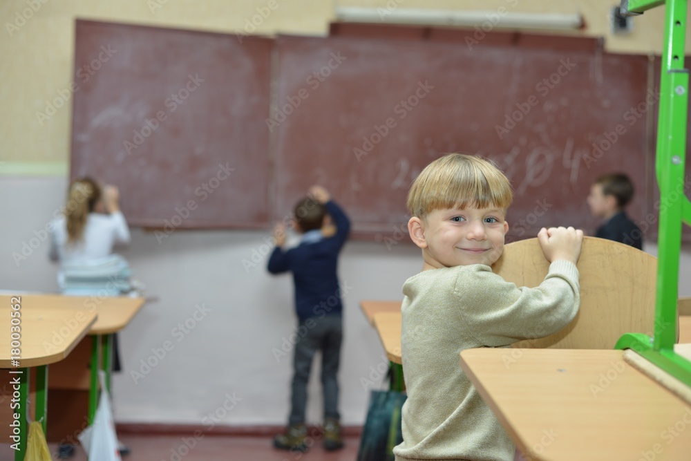 education, children, technology, science and people concept - group of happy kids building robots and making high five gesture at robotics school