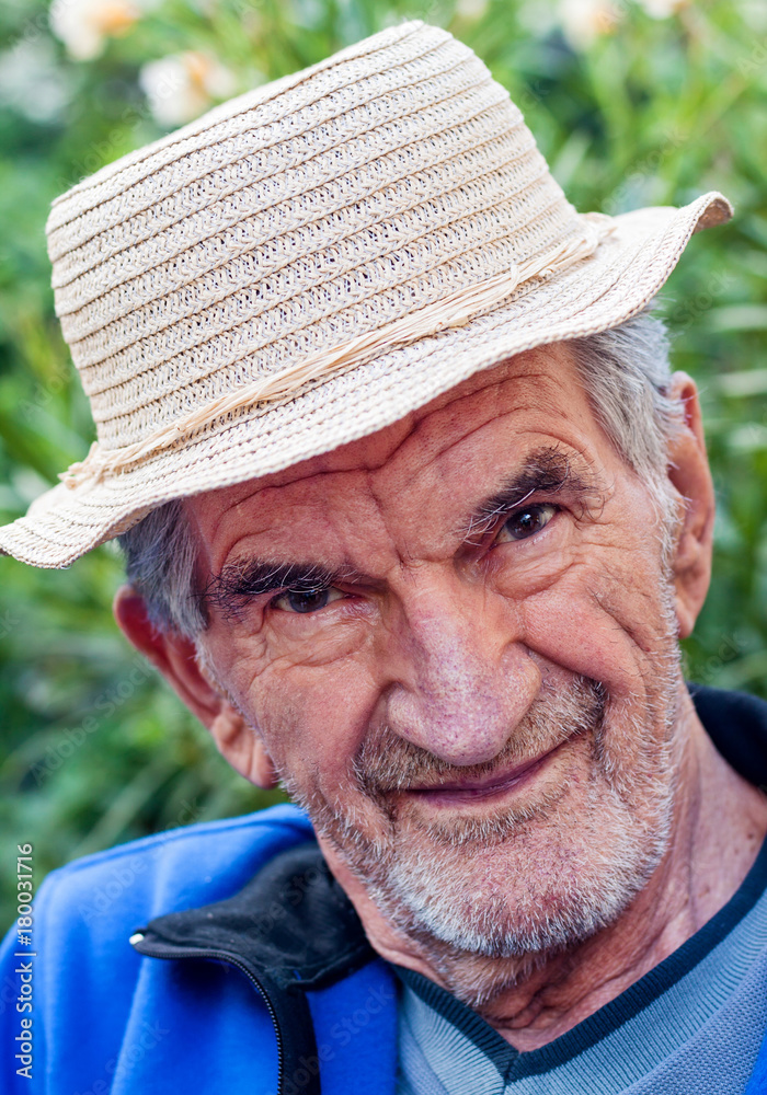 A portrait of a smiling senior man.