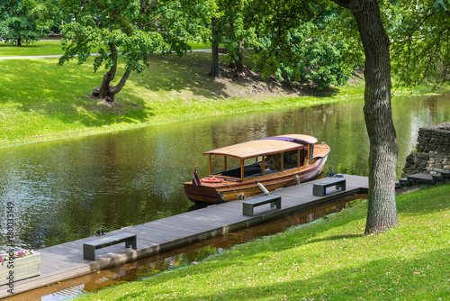 wood boat on the city river in the central park of Riga, Latvia.