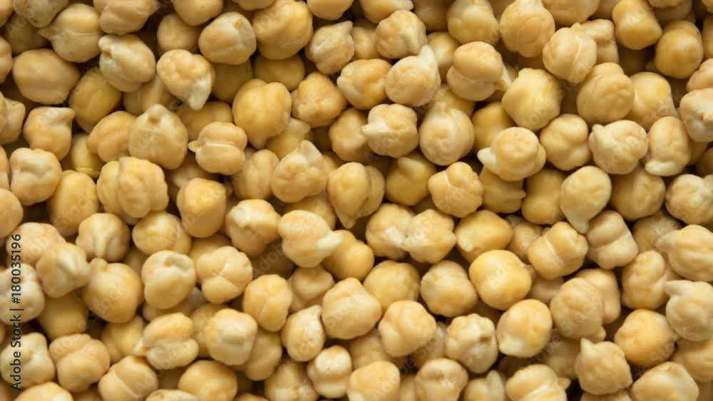 soaking Chickpeas in water. top view timelapse. soaking Chickpeas in water. top view timelapse.