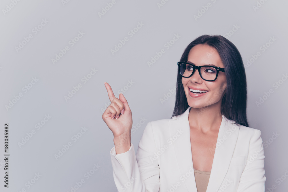 Welcome! Look! Successful gorgeous feminine intelligent stunning stylish leader expert in education, employment, pointing at empty space for advertising product or service