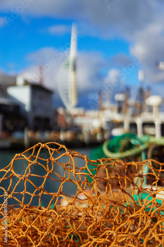 Yellow fishing net and city in the background.