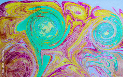 Abstract blue and pink pattern. Paper marbling in traditional turkish art style - ebru. Colorful art background texture. Handmade marble effect. 