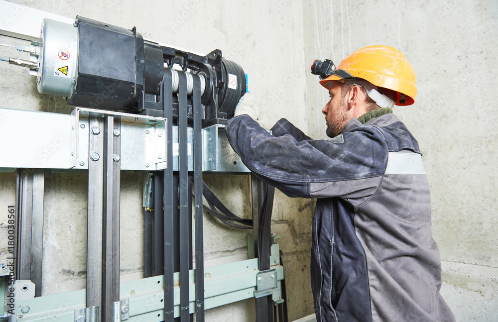 lift machinist repairing elevator in lift shaft lift machinist repairing elevator in lift shaft