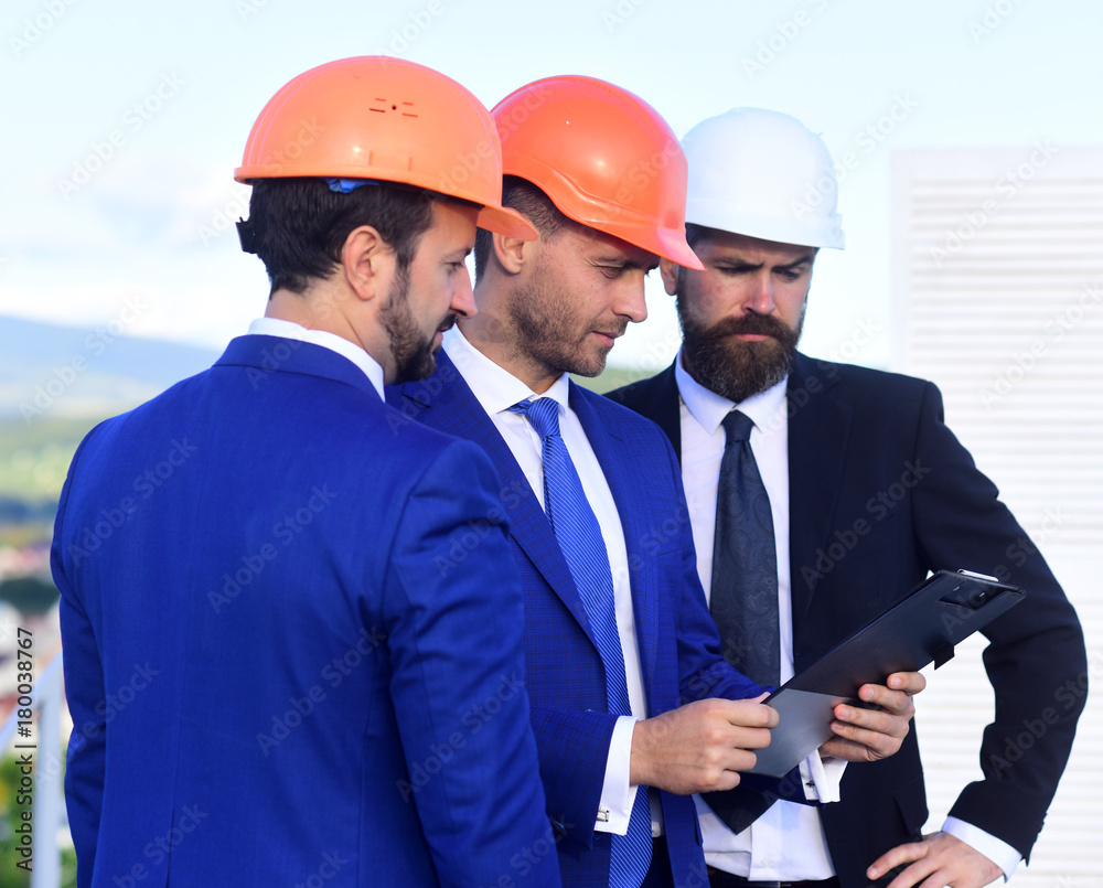 Board of architects wear smart suits, ties and hardhats Board of architects wear smart suits, ties and hardhats
