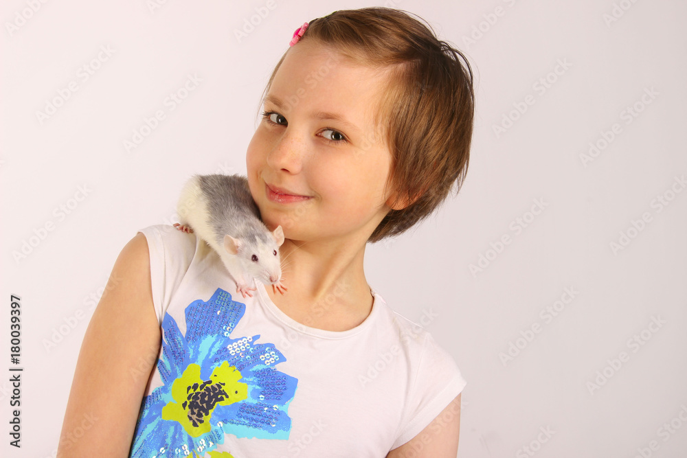 Shot of a happy little girl holding a Rat. Portrait of a little girl playing with her pet rat. Portrait of a pretty young girl with her pet rat.
Shot of a happy little girl holding a Rat. Portrait of a little girl playing with her pet rat. Portrait of a pretty young girl with her pet rat.