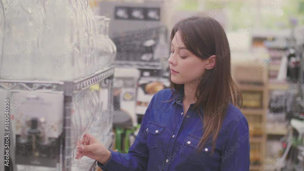 Beautiful Young Woman Buying Glass In Shop Beautiful Young Woman Buying Glass In Shop