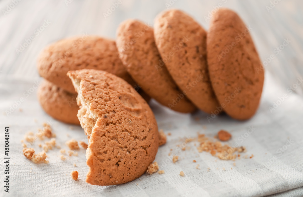 Tasty oatmeal cookies on table