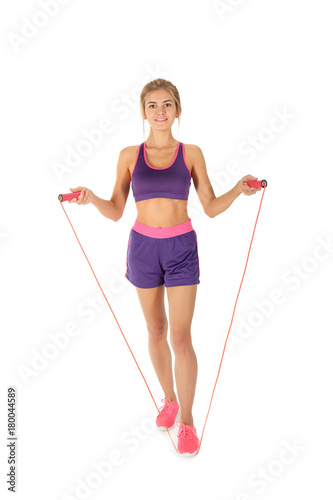 Sporty young woman with jum...