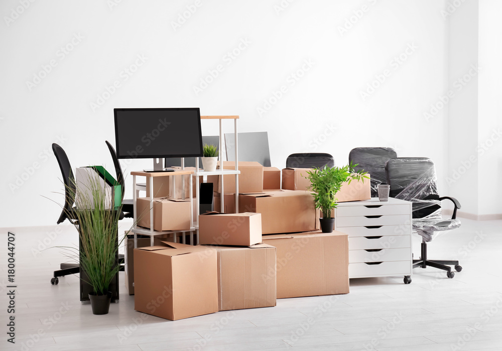 Carton boxes with stuff in empty room. Office move concept - obrazy, fototapety, plakaty 