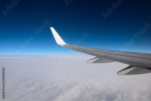 The wing of an airplane in a pure day sky. Between heaven and earth. Picture for add text message or frame website.
