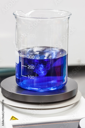 Glass beaker on top of a magnetic laboratory stirrer