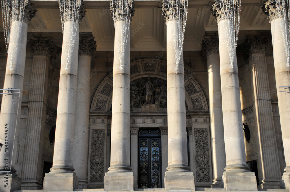 the coloumns and front door of leeds town hall in west yorkshire england