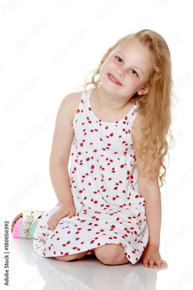 Little girl is sitting on the floor. Little girl is sitting on the floor.