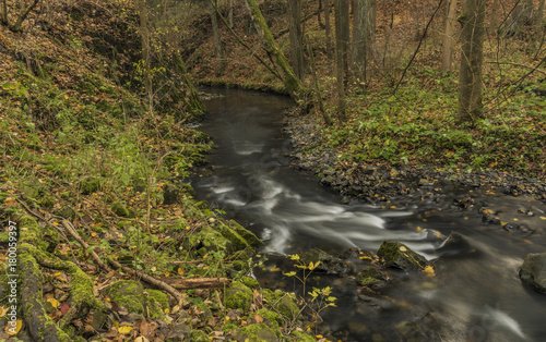 Bobri creek near waterfalls in autumn day photo