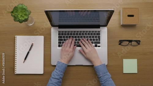 Overhead Footage Of Woman Using Laptop At Desk