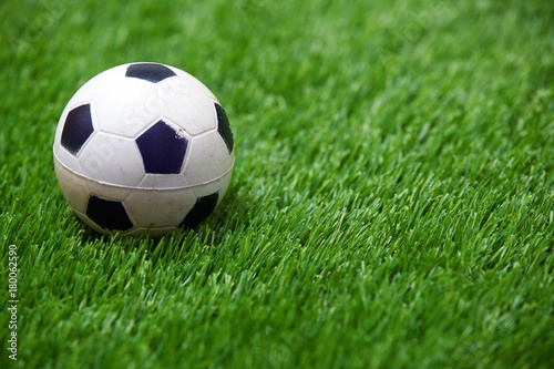 Soccer ball on a grass © Arman Zhenikeyev
