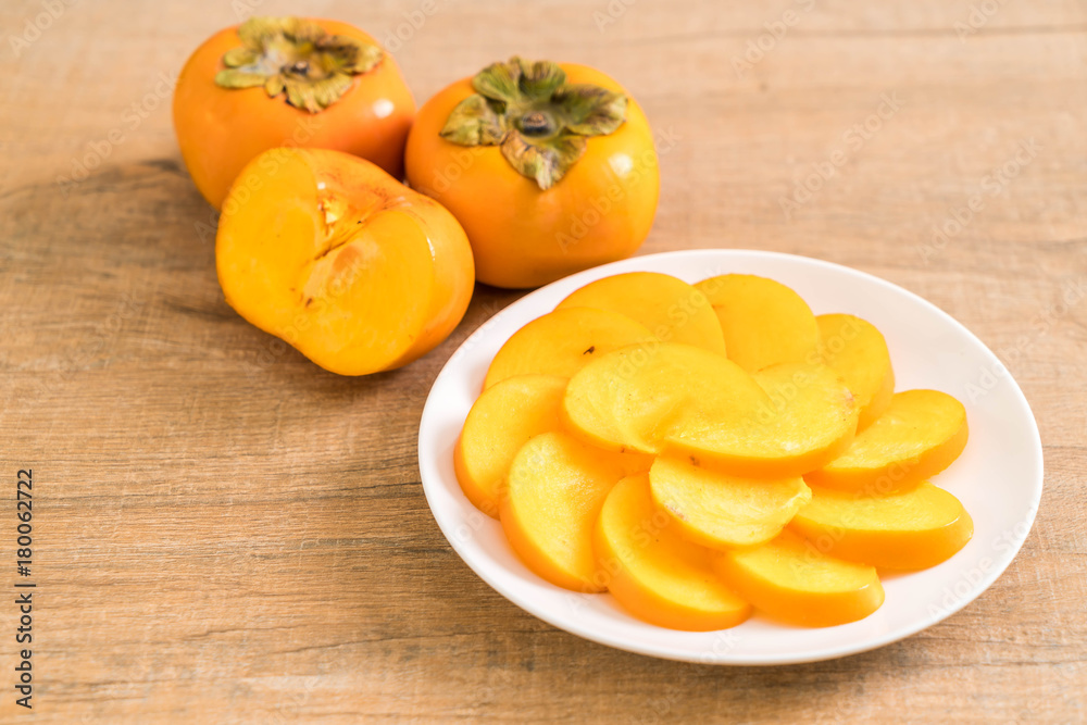 sliced persimmon on plate
