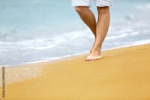 Closeup of a Person Walking on the Beach