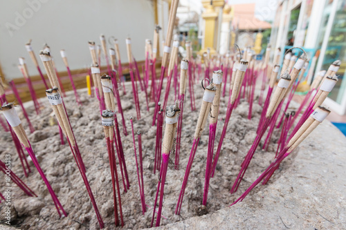 Incense sticks in pots to hallow of  Keeree Wong Temple in Nakhon Sawan Province
 photo