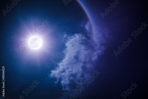 Moon halo phenomenon. Nighttime sky and bright full moon with shiny.