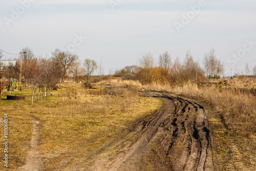 Dirty spring road in the countryside