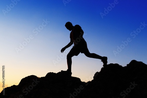 Man Walking on Rocks