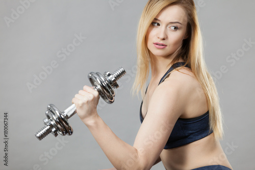 Woman training weight lifting