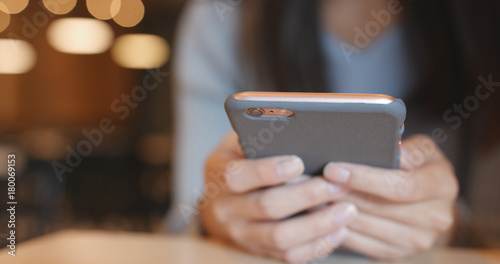 Using cellphone in coffee shop