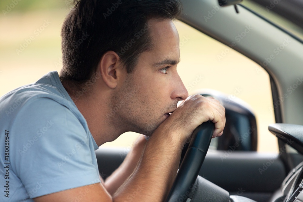 Portrait of a Man Thinking in his Car Portrait of a Man Thinking in his Car
