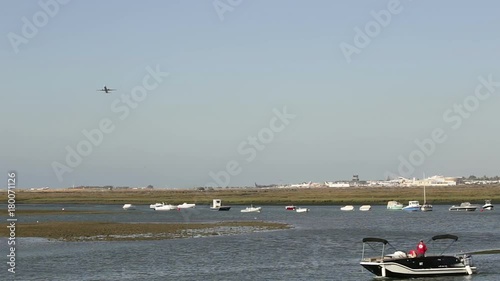 Takeoff of the plane over Ria Formosa in the city of Faro. Portugal