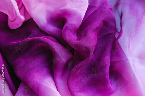 The purple texture of the pleated fabric. Pink georgette fabrics.