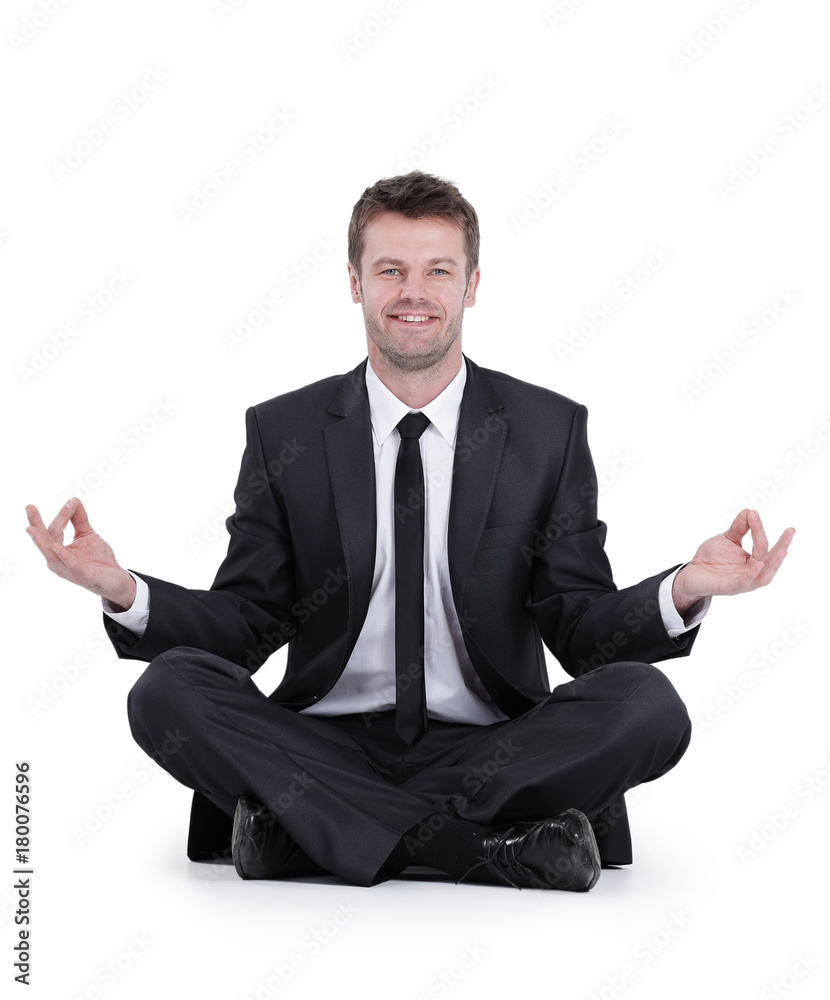 smiling businessman relaxes sitting in the Lotus position smiling businessman relaxes sitting in the Lotus position