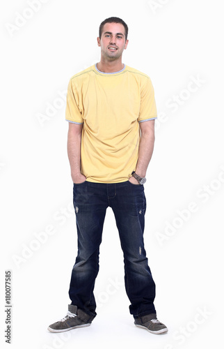 young man in a yellow t-shirt and jeans.