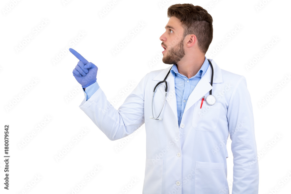 Portrait of a Young smiling male doctor pointing finger away isolated on a white background Portrait of a Young smiling male doctor pointing finger away isolated on a white background