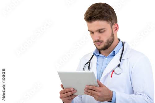 Young Doctor using tablet isolated on white