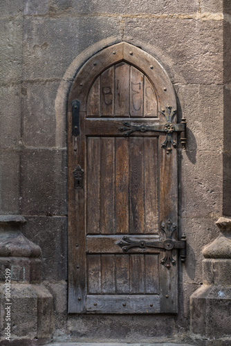 Medieval wooden door old church photo