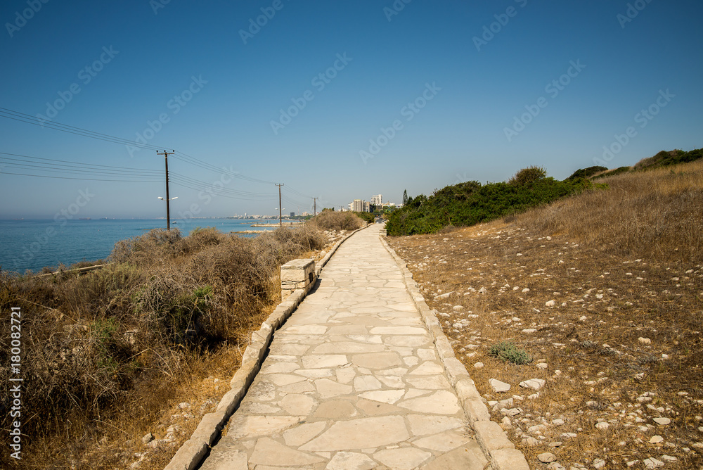 Paved pedestrian path along the sea to ancient Acropolis site at Limassol