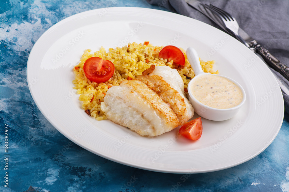 Fried pike perch fillet and bulgur. Fried fish dinner. Healthy eating Fried pike perch fillet and bulgur. Fried fish dinner. Healthy eating