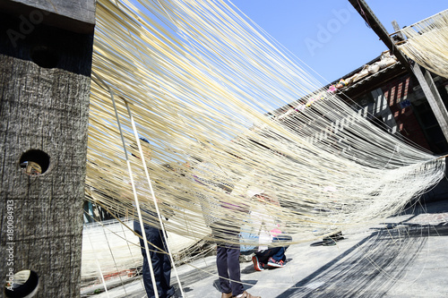 
Changhua Lukang Fuxing handmade noodles - October 22 ,2017:The traditional way to dry fine flour in Taiwan, hanging chinese noodles. photo